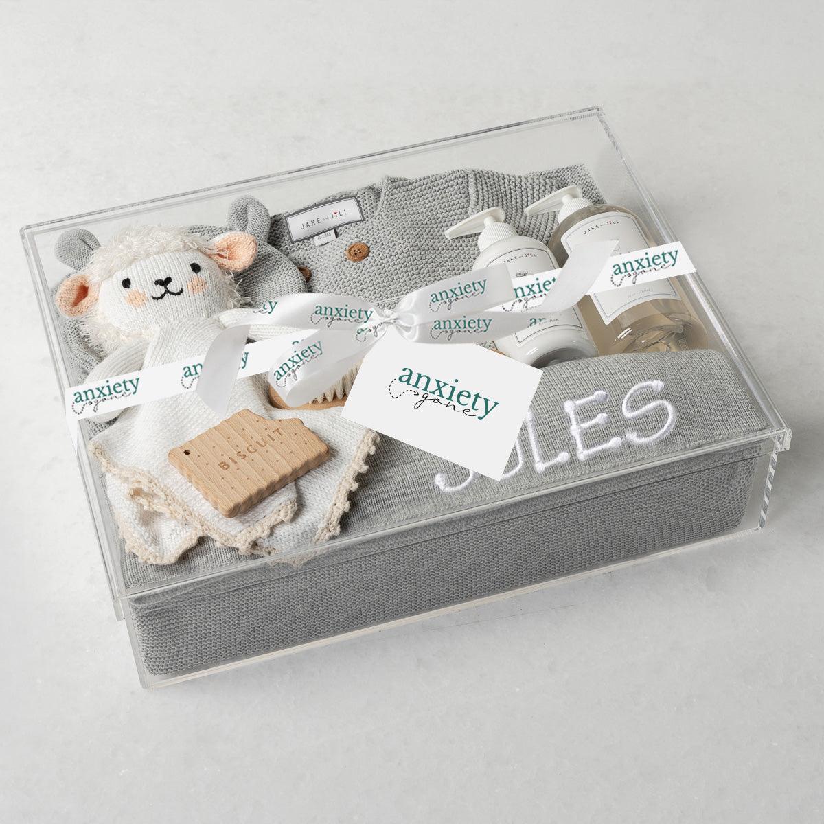 Embroidered Bundle New Baby Gift Box – Personalized baby gift set with cotton knit blanket, button-up sweater, hat, Jellycat Cream Bunny, wooden teether, baby lotion, baby wash, and custom embroidery in a keepsake acrylic box. Perfect for baby showers, newborn gifts, and personalized keepsakes.