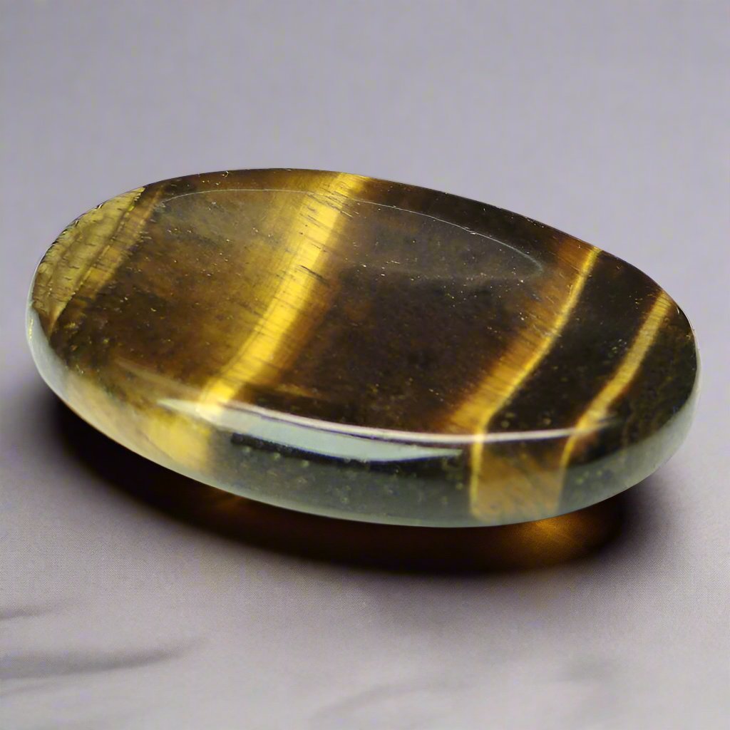 Tiger&#39;s Eye Worry Stone for anxiety relief and releasing fear, making it an excellent fidget toy and crystal for anixety.