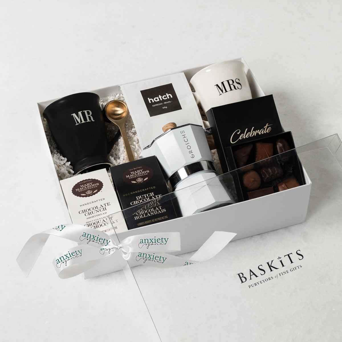 Celebrate Love Gift Box featuring self-care items like Mr. &amp; Mrs. mugs, espresso coffee maker, gourmet treats, and more—ideal for engagement gifts, anniversary presents, thank you gift baskets, and self-care gift baskets.