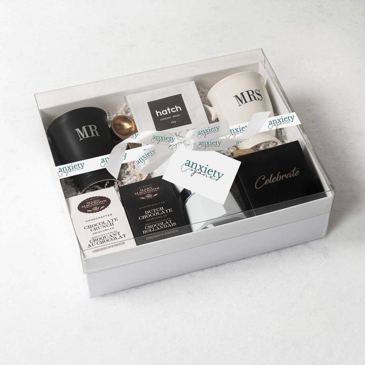 Celebrate Love Gift Box featuring self-care items like Mr. &amp; Mrs. mugs, espresso coffee maker, gourmet treats, and more—ideal for engagement gifts, anniversary presents, thank you gift baskets, and self-care gift baskets.