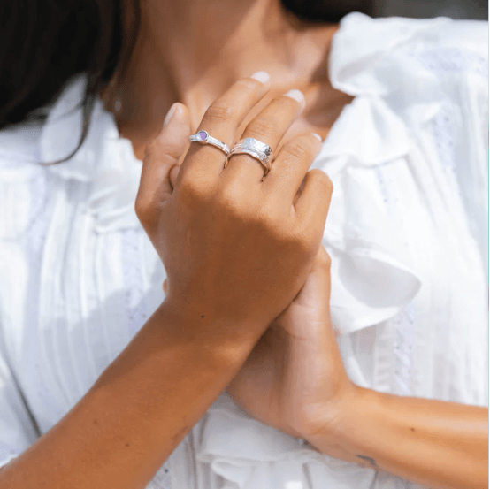 Sterling Silver Anxiety Ring with scalloped edges and single spinning band, displayed with complimentary MeditationRings Tin and Travel Pouch