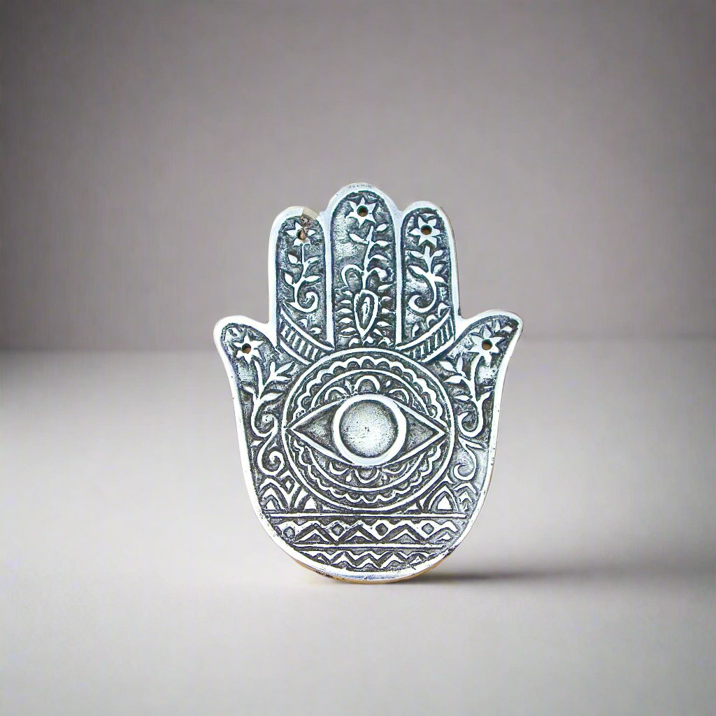 Hand of Compassion Hamsa Aluminum Incense Burner with 5 slots for incense sticks and a base for cones.