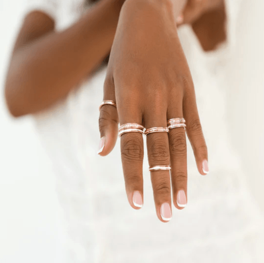 14 KT Rose Gold figit ring with hammered design and spinning center band, displayed with complimentary MeditationRings Tin and Travel Pouch