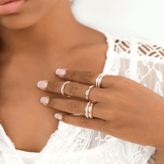 14 KT Rose Gold figit ring with hammered design and spinning center band, displayed with complimentary MeditationRings Tin and Travel Pouch