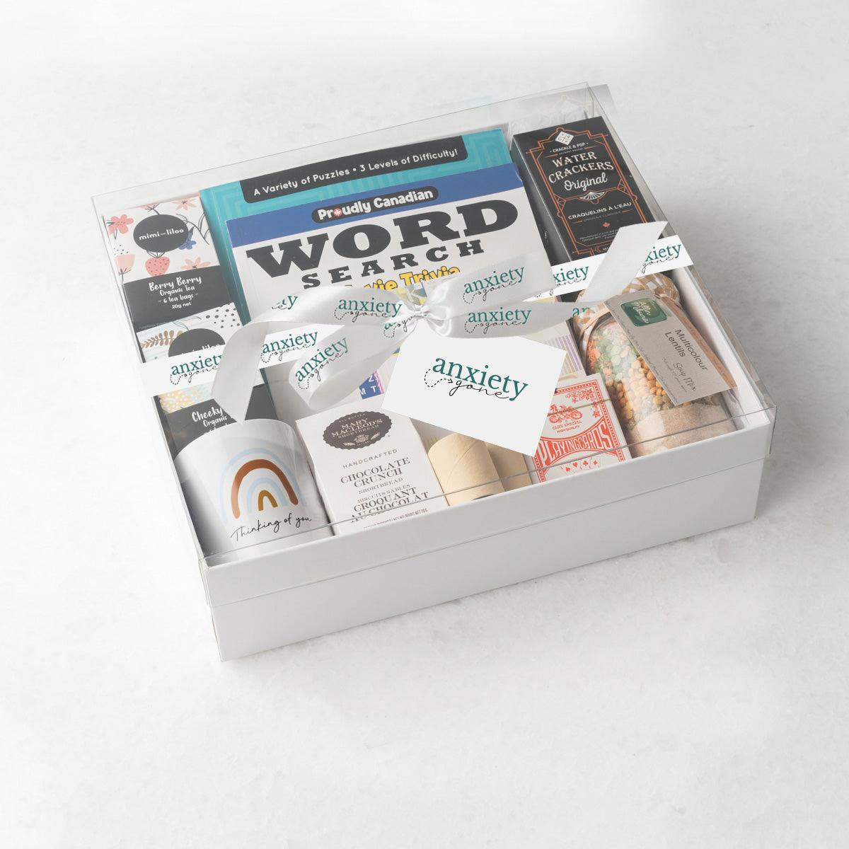 Thinking of You Gift Box – A thoughtful get well soon gifts for men featuring tea, puzzles, cookies, playing cards, and more for mental health and relaxation.