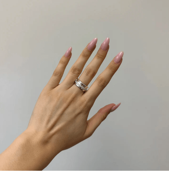 Sterling Silver Hammered Spinner Ring with spinning CZ stone band, displayed with complimentary MeditationRings Tin and Travel Pouch