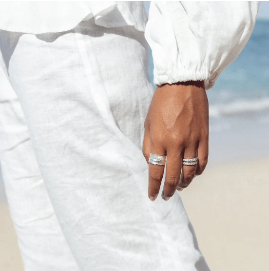 Terra Sterling Silver Meditation Ring with organic leaf pattern and spinning band, displayed with complimentary jewelry tin