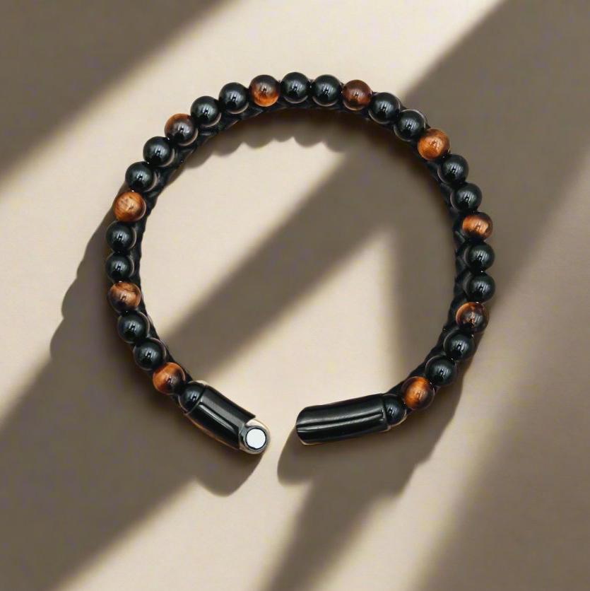 Tiger&#39;s Eye Leather Bracelet with braided black leather for mental clarity and emotional strength.