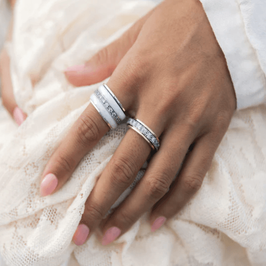 Elegant meditation ring with Yellow Gold edges and a large CZ spinning band, displayed with complimentary MeditationRings Tin and Travel Pouch