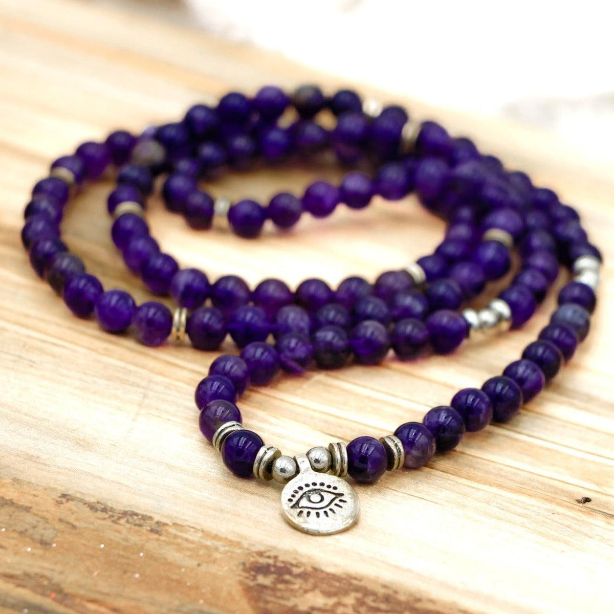 Peaceful Amethyst Third Eye Mala Bead Necklace for meditation, chakra healing, and spiritual balance.