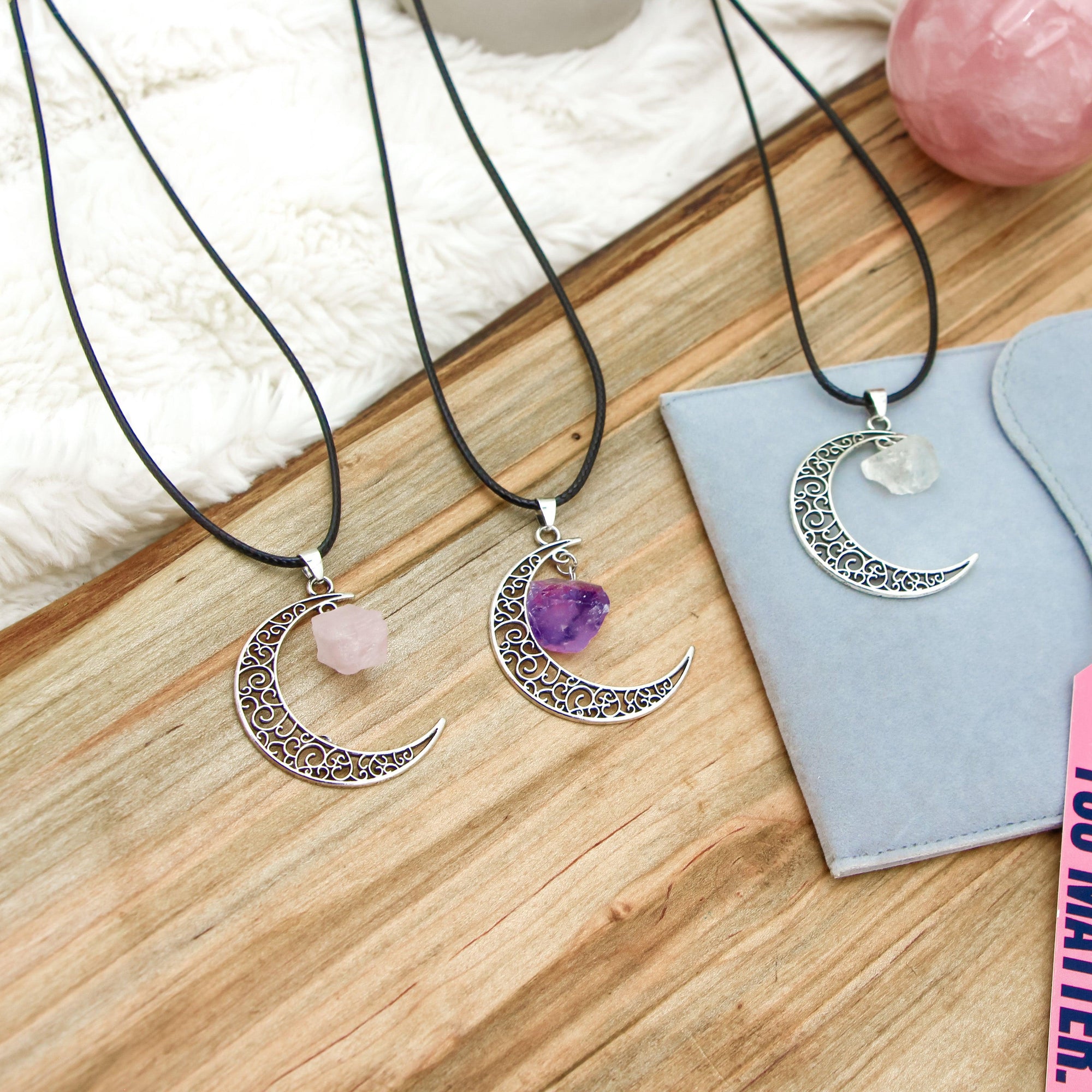 Crescent Moon Gemstone Necklace using the best crystals for anxiety, such as rose quartz, amethyst, and clear quartz for healing and spiritual energy