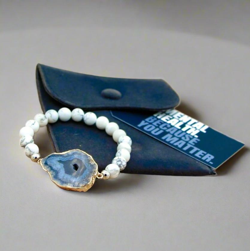 Elevate your style and embrace inner peace with our Soothing Snowy White Howlite Bracelet, crafted to bring calming vibrations to your mind, body, and spirit. This beautiful women&#39;s bracelet is made with high-quality white howlite stones, known for their ability to relieve stress, anxiety, and tension. Paired with a stunning agate slab, this bracelet seamlessly blends energy healing and fashion, offering both therapeutic benefits and a chic, versatile accessory for everyday wear.

Whether you’re seeking rel